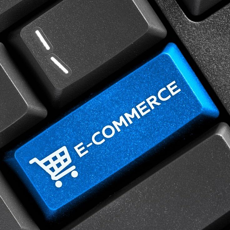 E-commerce word blue button on black keyboard computer, online s
